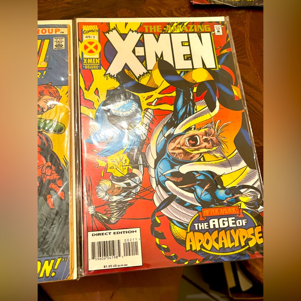 X-Men comic and daredevil. ￼